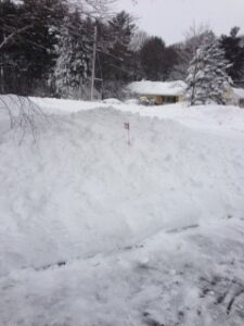snow stakes helping show the way for plow drivers